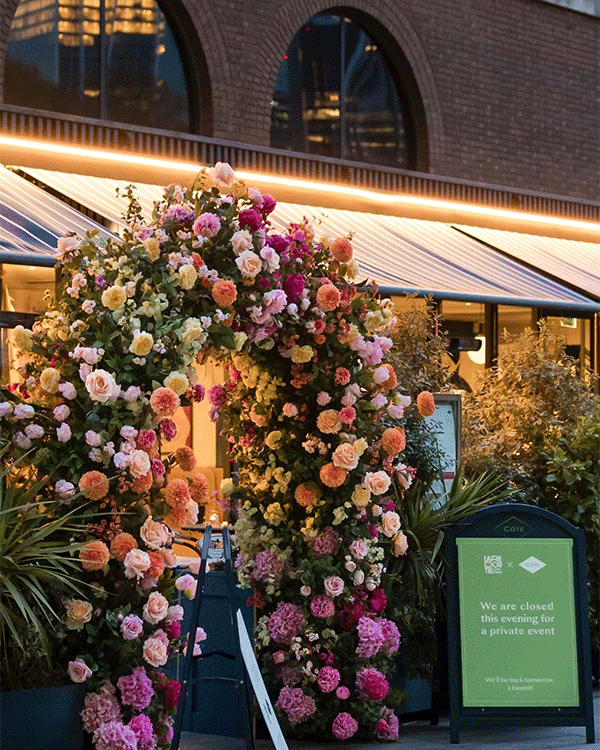 Spring themed floral arch at restaurant event in London