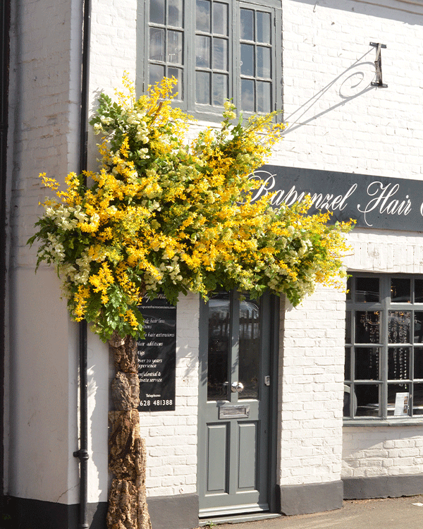 Luxury floral decorated brand store front for seasonal event in Bucks village