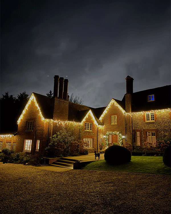 House with exterior Christmas lighting