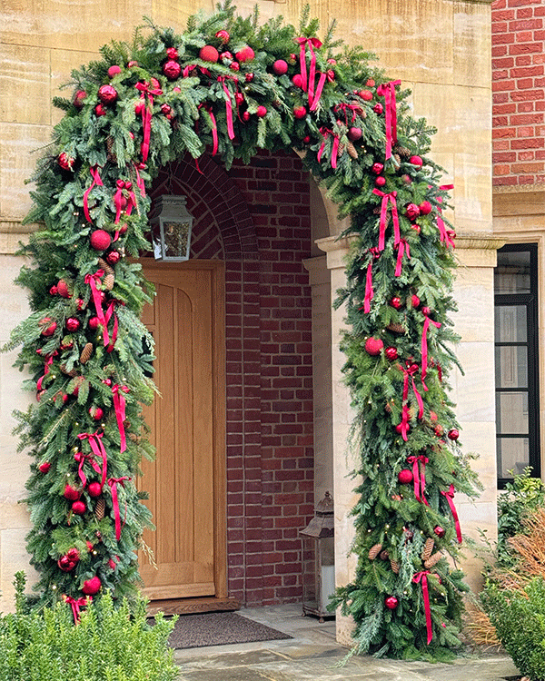 Beautiful Christmas archway around front door of residential home in Herfordshire
