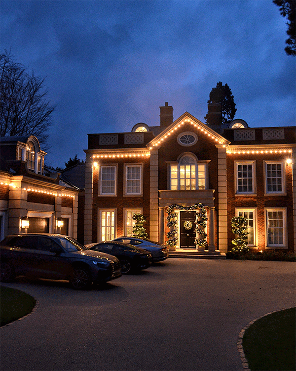 Grand house with exterior Christmas lighting