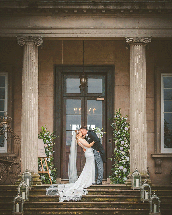 Flowers for wedding day with couple celebrating outside venue in Berkshire