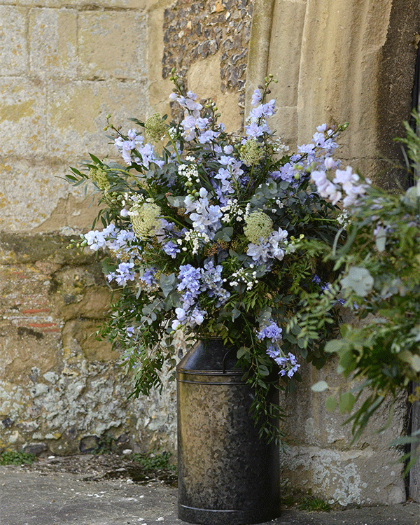Wedding entrance purple floral display in Surrey